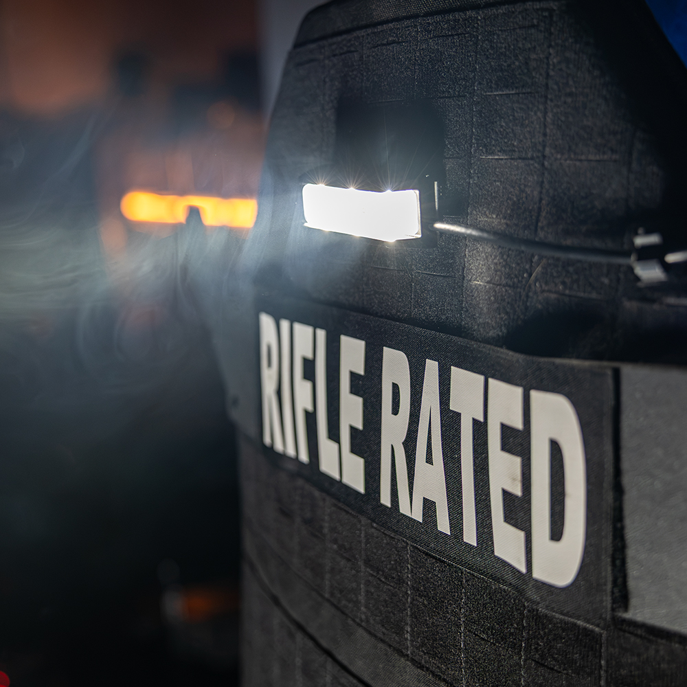 Close-up of the Taker B40 boltless mount on a curved shield